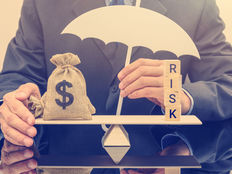 A%20white%20umbrella%2c%20protects%20a%20dollar%20bag%20on%20basic%20balance%20scale